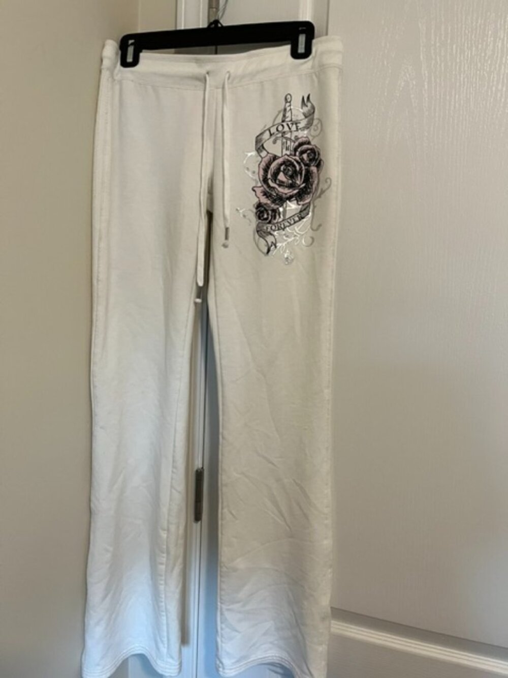 Habitual tattoo-inspired ivory sweatpants.